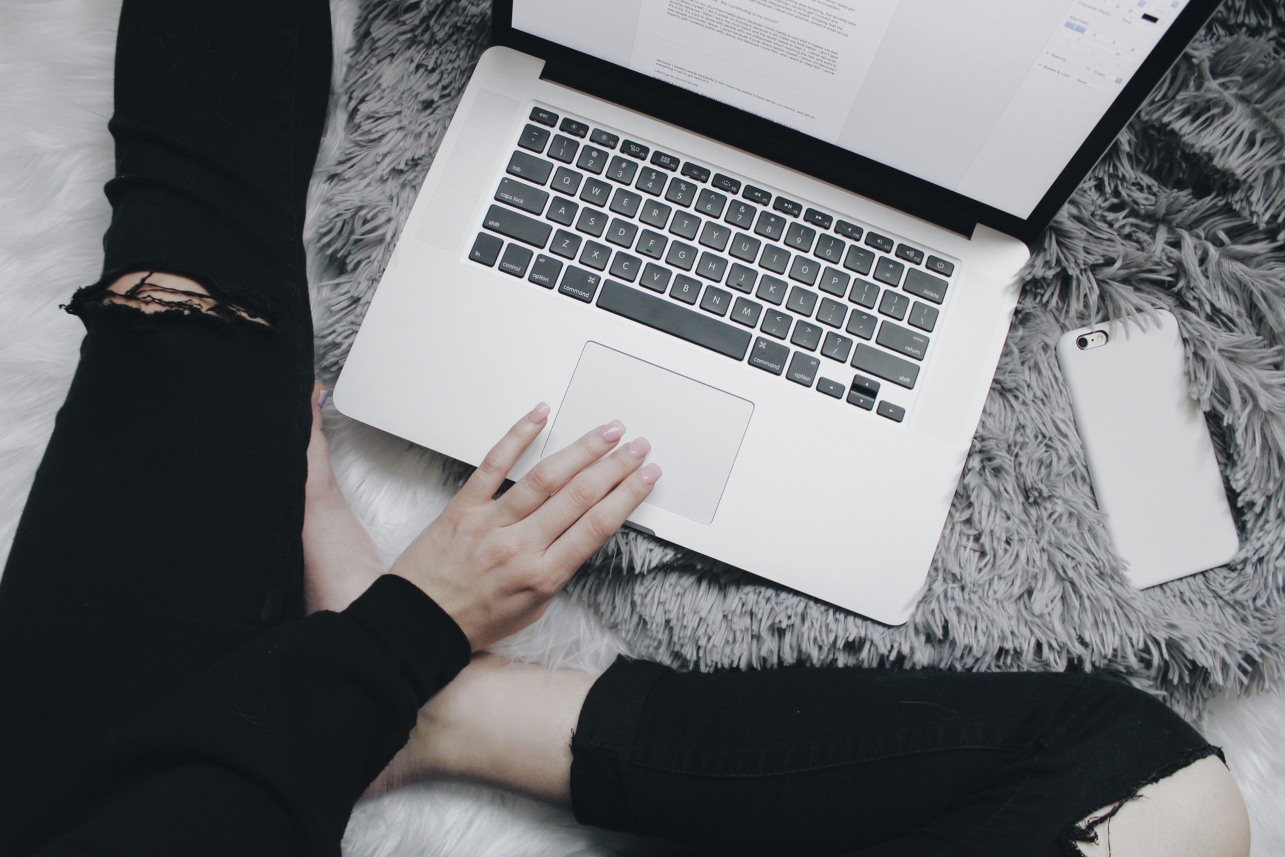 Close up of hands on a laptop