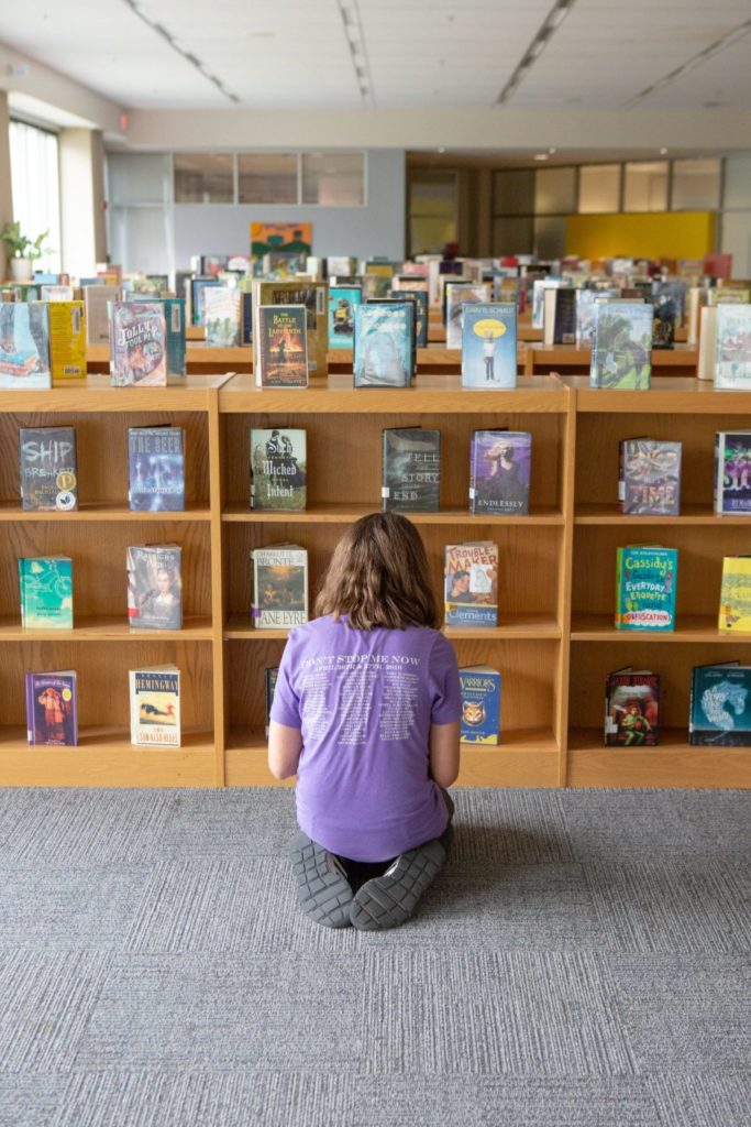 Girl picking library book