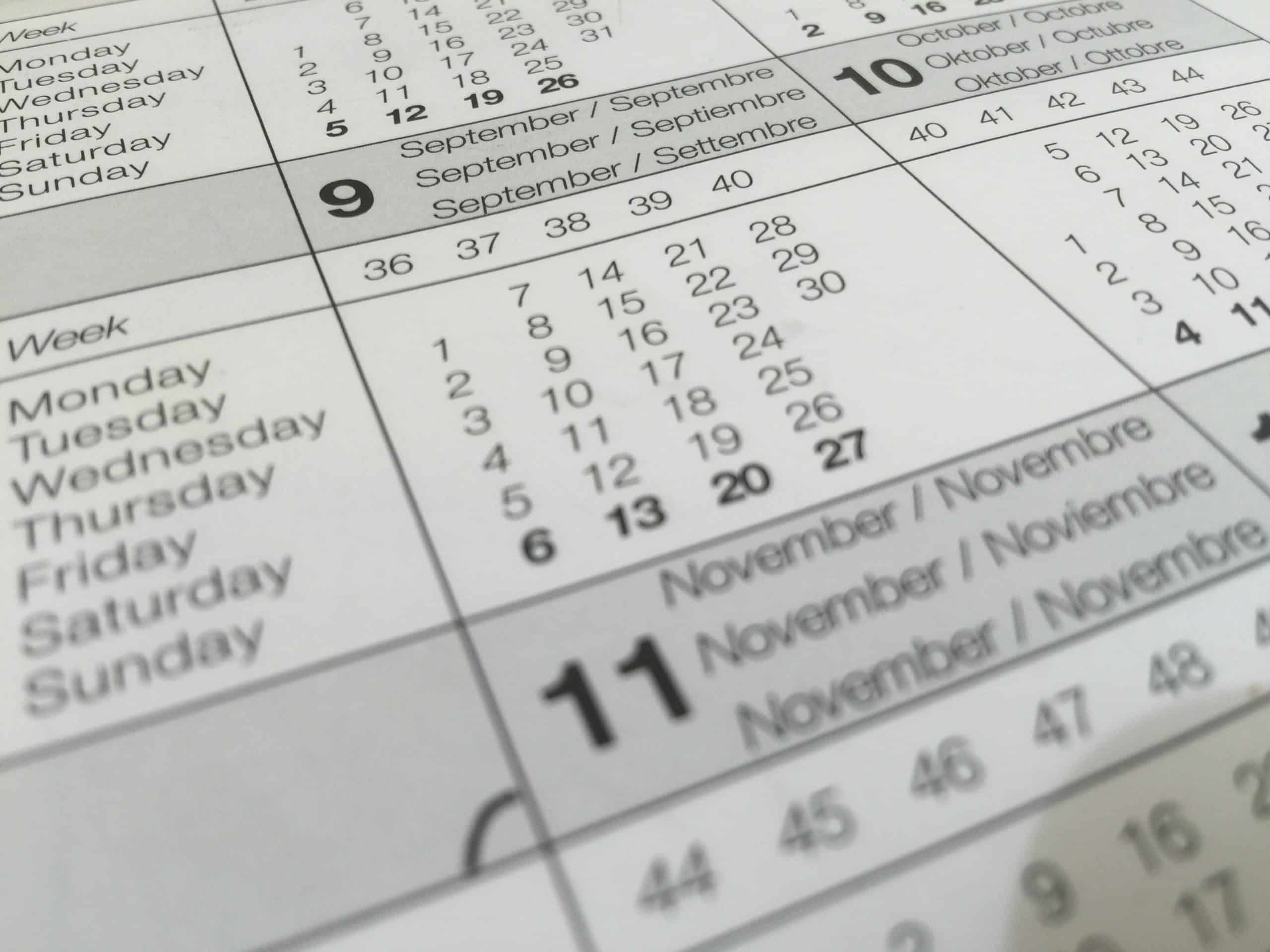 decorative image showing a close up of a calendar schedule