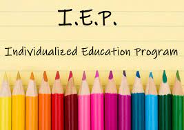 IEP individualized education program, with colored pencils on the bottom facing upward